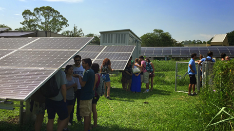 students visiting solar research facility in Sao Paolo, Brazil