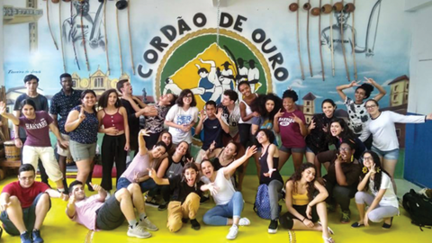 students in the MLAB program standing in front of a mural