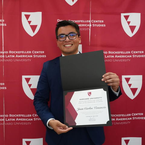 Student showing certificate