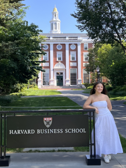 Student in from of Harvard Business School